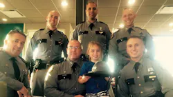 A picture of a little girl posing with law enforcement officers following the funeral for a slain Kentucky State Police Trooper Joseph Cameron Ponder has gone viral. A picture of a little girl posing with law enforcement officers following the funeral for a slain Kentucky State Police Trooper Joseph Cameron Ponder has gone viral.