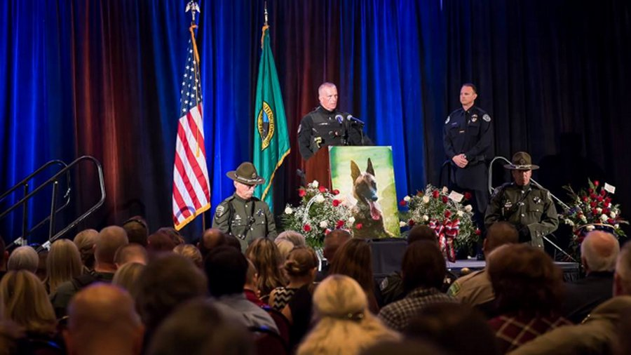 Mourners gathered Tuesday evening to pay their final respects to Ike, a Vancouver Police Department dog killed in the line of duty earlier this month.