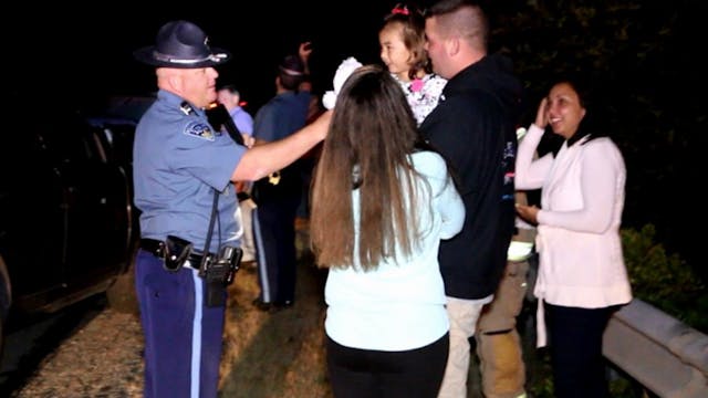 A Massachusetts State Police trooper surprised a little girl Sunday night after her family was involved in a collision on a highway.
