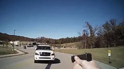 Sand Springs Police Officer Matt Stacy fired twice as a suspect aimed a stolen SUV directly at him last week. Sand Springs Police Officer Matt Stacy fired twice as a suspect aimed a stolen SUV directly at him last week.