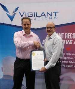 Vigilant Solutions&apos; Shawn Smith receiving certificate from Long Beach Police Department&apos;s Deputy Chief David Hendricks.