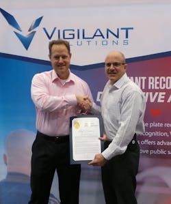 Vigilant Solutions' Shawn Smith receiving certificate from Long Beach Police Department's Deputy Chief David Hendricks. Vigilant Solutions' Shawn Smith receiving certificate from Long Beach Police Department's Deputy Chief David Hendricks.