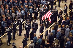 The Colorado Springs Police Honor Guard carries in the casket of Garrett Swasey, the 44-year-old University of Colorado at Colorado Springs police officer and six-year veteran of the department, during the funeral service at New Life Church on Dec. 4 in Colorado Springs, Colo. The Colorado Springs Police Honor Guard carries in the casket of Garrett Swasey, the 44-year-old University of Colorado at Colorado Springs police officer and six-year veteran of the department, during the funeral service at New Life Church on Dec. 4 in Colorado Springs, Colo.