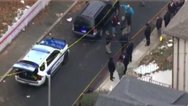 A Boston police officer was shot in the leg Friday morning and the suspected gunman was taken into custody.
