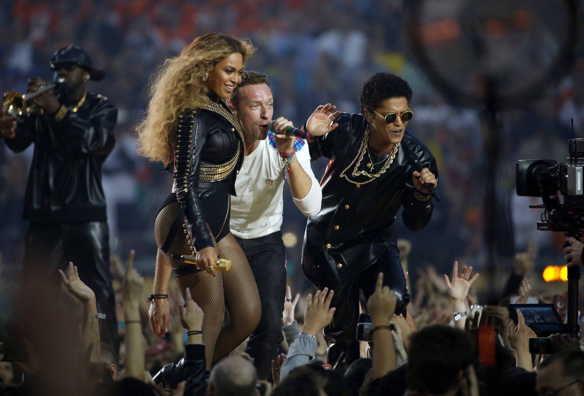 Beyonce, left, sings with Chris Martin of Coldplay and Bruno Mars, right, during the halftime show at Super Bowl 50 at Levi's Stadium in Santa Clara, Calif. on Feb. 7.