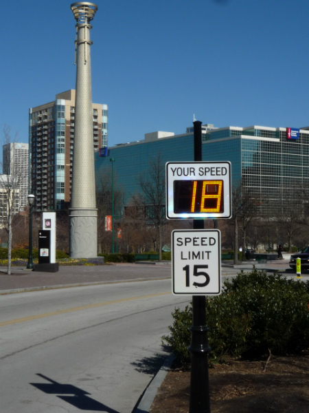 Radarsign TC-500 Radar speed sign with 12' LED display on black decorative pole /Municipal traffic calming-Centennial Park, Atlanta, GA. Helping drivers make better choices&mdash;to comply with speed limits&mdash;is one of the best benefits of driver feedback signs. (Photo courtesy of Radarsign)