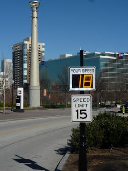 Radarsign TC-500 Radar speed sign with 12&apos; LED display on black decorative pole /Municipal traffic calming-Centennial Park, Atlanta, GA. Helping drivers make better choices&mdash;to comply with speed limits&mdash;is one of the best benefits of driver feedback signs. (Photo courtesy of Radarsign)
