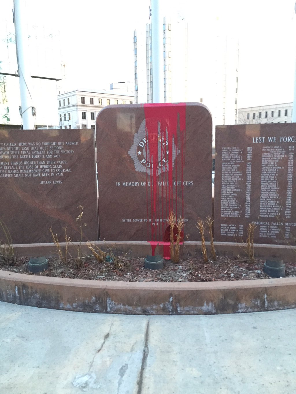 A memorial honoring fallen officers was vandalized early Monday morning, almost exactly one year since it was first defaced, and in a similar fashion.