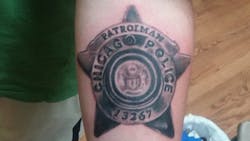 An independent arbitrator has sided with a police union over an edict requiring rank-and-file Chicago officers to cover up their tattoos. An independent arbitrator has sided with a police union over an edict requiring rank-and-file Chicago officers to cover up their tattoos.