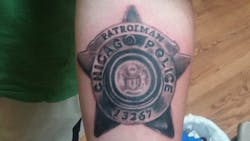 An independent arbitrator has sided with a police union over an edict requiring rank-and-file Chicago officers to cover up their tattoos.