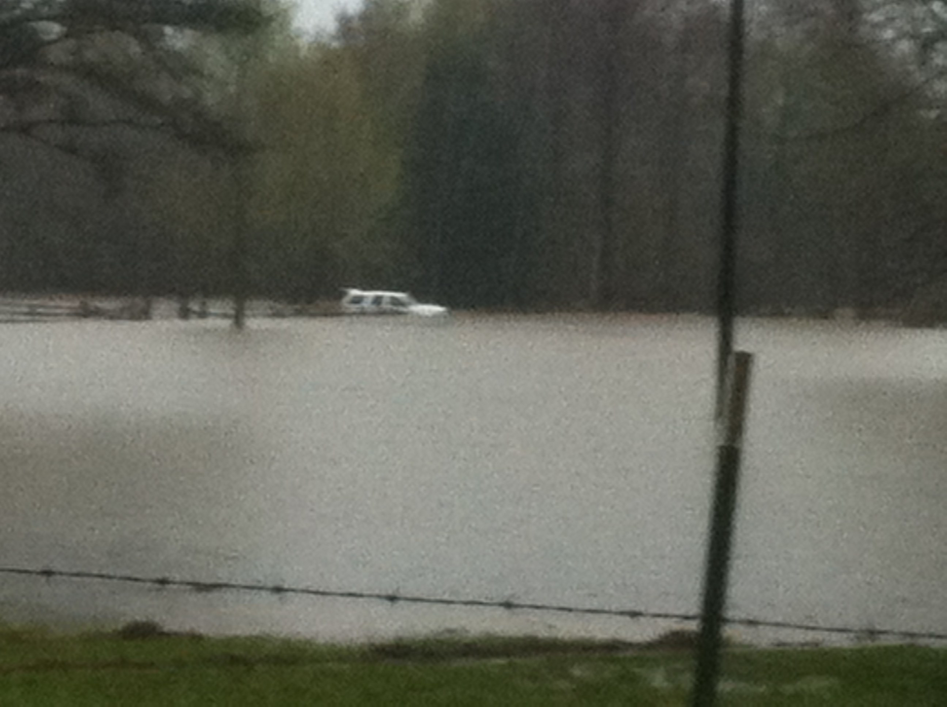A Haughton Police Department SUV is seen in flood waters following an attempted rescue by a police officer last week.