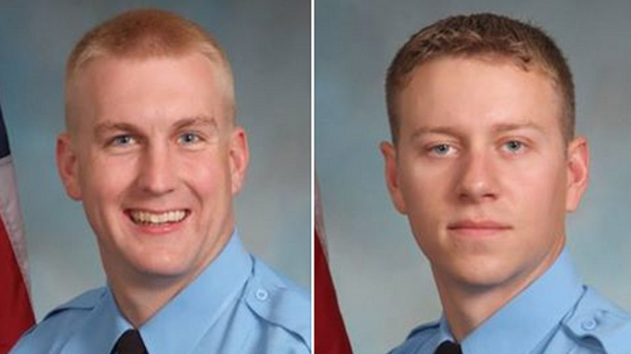 Officers David McKeown, left, and Jesse Hempen