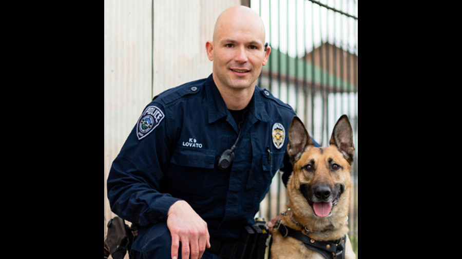 Officer Luis Lovato, left, and K-9 Aldo