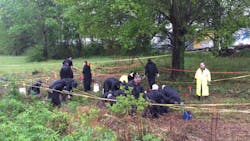 Mobile police search for evidence after an officer was shot during a physical altercation with a suspect early Friday morning. Mobile police search for evidence after an officer was shot during a physical altercation with a suspect early Friday morning.