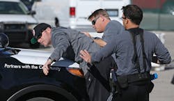 Las Vegas Metropolitan Police Department Officers Hector Leal, from right, and Chris Church detain fellow officer Joe Hearns in a car stop scenario during 'Advanced Officer Skills Training' at the Mojave Training Center on Feb. 18. Hearns played a driver showing levels of aggressive resistance on the 'Use of Force Model' scale. Las Vegas Metropolitan Police Department Officers Hector Leal, from right, and Chris Church detain fellow officer Joe Hearns in a car stop scenario during 'Advanced Officer Skills Training' at the Mojave Training Center on Feb. 18. Hearns played a driver showing levels of aggressive resistance on the 'Use of Force Model' scale.