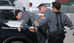 Las Vegas Metropolitan Police Department Officers Hector Leal, from right, and Chris Church detain fellow officer Joe Hearns in a car stop scenario during &apos;Advanced Officer Skills Training&apos; at the Mojave Training Center on Feb. 18. Hearns played a driver showing levels of aggressive resistance on the &apos;Use of Force Model&apos; scale.