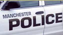 Two Manchester police officers were shot and the suspected gunman was being sought early Friday morning.
