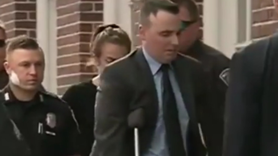 Manchester Officers Ryan Hardy, left, and Matthew O'Connor, right, sat in court Monday as Judge Gregory Michael ordered 32-year-old Ian MacPherson be held without bail.