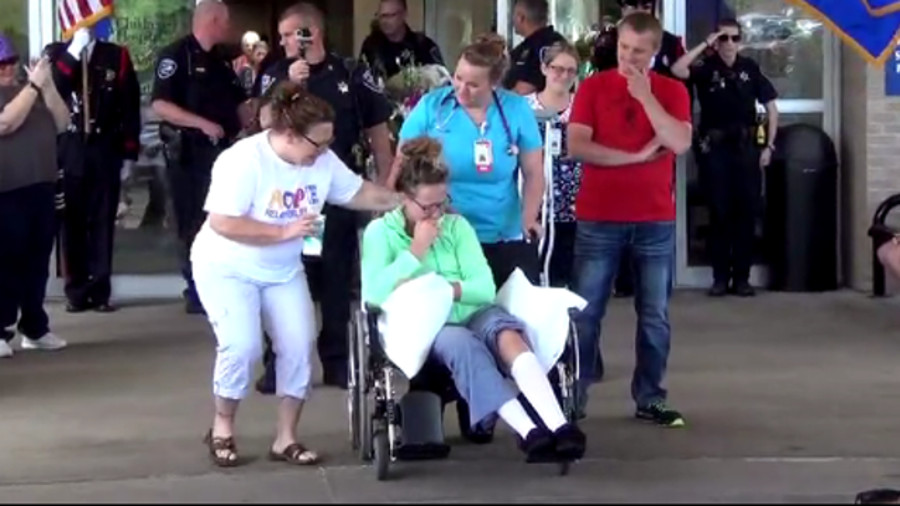 Appleton Police Officer Stephanie Wiener, who was shot with her own gun during a struggle with a suspect over the weekend, went home on Tuesday.