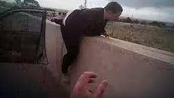 Newly released body camera video shows the moment when Albuquerque police officers grabbed a woman as she attempted to jump off of a bridge Tuesday.
