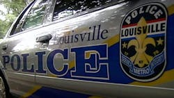 A Louisville police officer was shot and wounded late Saturday night and authorities were searching for his suspected gunman.