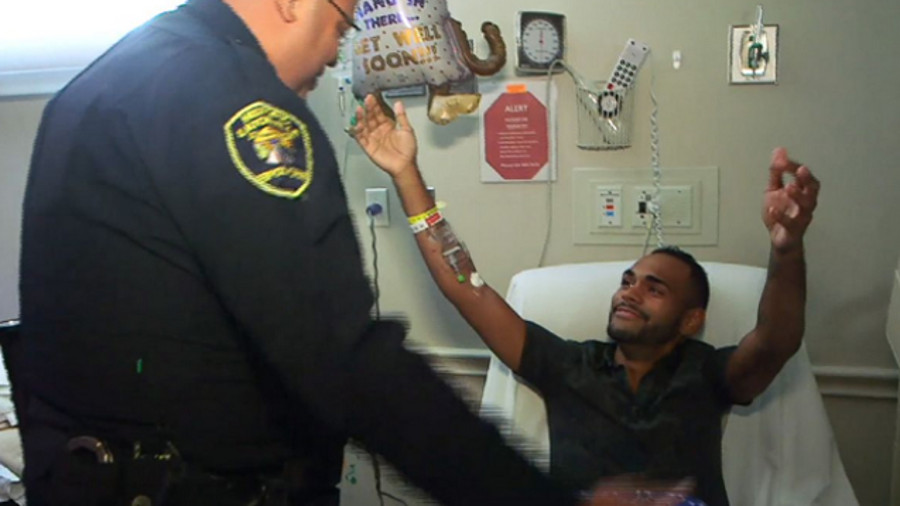 Pulse nightclub shooting victim Angel Colon, right, reunites with Eatonville Police Officer Omar Delgado.