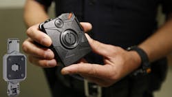 TASER will loan the Cleveland Police Department 300 mounting units, pictured left, so that officers in can attach Axon cameras to their riot gear.