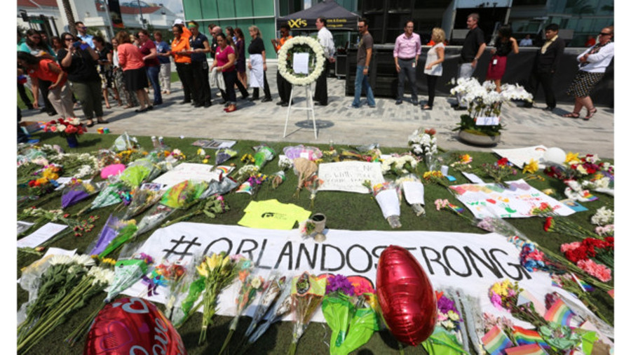 A memorial at Dr. Phillips Center for the Pulse Nightclub victims is growing in size Monday as people come to pay their respects after the horrific mass shooting early Sunday morning in Orlando.