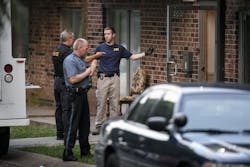 FBI evidence recovery team members search inside the Waldo Heights apartment complex at 8101 Campbell Street in Kansas City, Mo., on July 17. FBI evidence recovery team members search inside the Waldo Heights apartment complex at 8101 Campbell Street in Kansas City, Mo., on July 17.