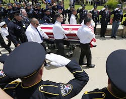 Police from around the country honor Dallas Police officer Patrick Zamarripa at Dallas Fort Worth National Cemetery on July 16 in Dallas. Police from around the country honor Dallas Police officer Patrick Zamarripa at Dallas Fort Worth National Cemetery on July 16 in Dallas.