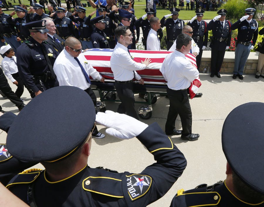 Police from around the country honor Dallas Police officer Patrick Zamarripa at Dallas Fort Worth National Cemetery on July 16 in Dallas.