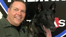 Arlington Police K-9 Handler Vince Ramsour, left, is seen with K-9 Mojo. Arlington Police K-9 Handler Vince Ramsour, left, is seen with K-9 Mojo.