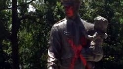 The Richmond Police Memorial statue of an officer holding a child was found tagged with a big red &apos;X&apos; and &apos;Justice for Alton&apos; sprayed on the ground.