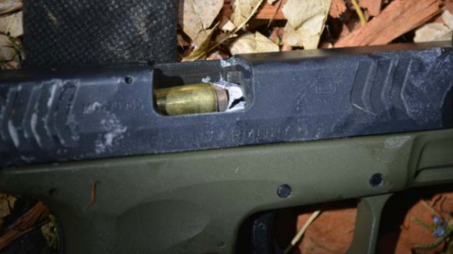 It was determined that one of the shots that Deputy Marquez fired from his .45 caliber handgun actually hit the suspect's 40 caliber handgun and traveled down the barrel.
