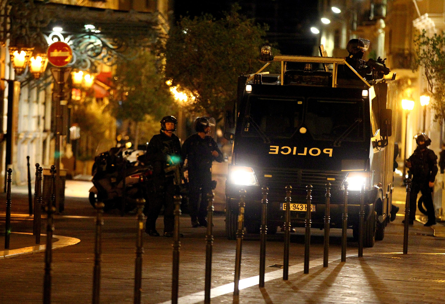 Police on the Promenade des Anglais in Nice, France, on July 14 after a truck sped into a crowd during Bastille Day celebrations in the southern French city, killing dozens.