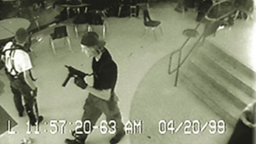 This widely published photo from the school's security camera caught Harris and Klebold in the school's cafeteria in the midst of their attack.