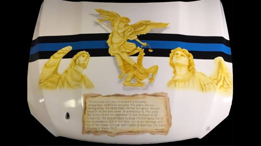 Clay County Sheriff's Deputy Craig Greco has spent much of his free time on a project honoring a colleague who was shot at while pursuit a suspect.