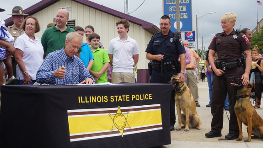 Gov. Bruce Rauner signed legislation over the weekend that gives retiring police dogs the ability to be adopted by their handlers.