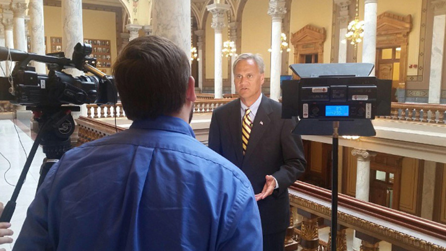 Indiana State Senator Jim Merritt speaks to the media about legislation that would protect law enforcement officers who are attacked while off duty.