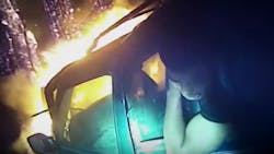 Newly released body camera video shows Athens-Clarke County Police Officer Dan Whitney heroically rush to a burning SUV and pull out a trapped passenger.