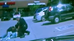 Newly released dashcam video shows a Good Samaritan tackle a man attacking an Edmond police officer.