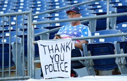 A fan shows his support for the police before a preseason game between the San Francisco 49ers and the San Diego Chargers on Sept. 1 at Qualcomm Stadium in San Diego. A fan shows his support for the police before a preseason game between the San Francisco 49ers and the San Diego Chargers on Sept. 1 at Qualcomm Stadium in San Diego.