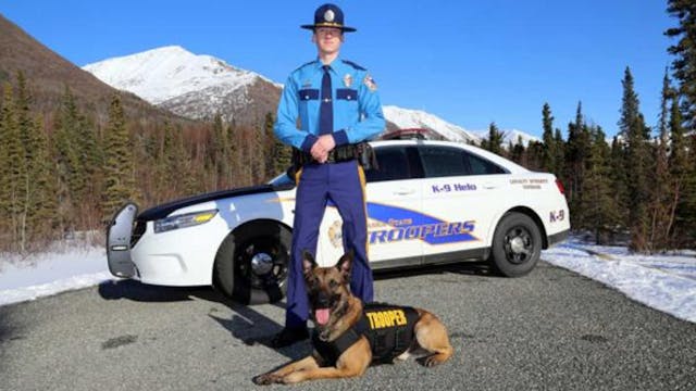 Trooper Chris Havens poses with K-9 Helo