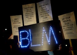 Protesters hold signs during a gathering outside Jail Central in uptown Charlotte on Sept. 30. Protesters hold signs during a gathering outside Jail Central in uptown Charlotte on Sept. 30.