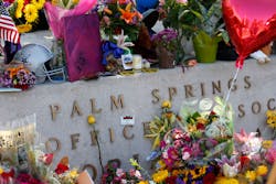 Mourners&apos; flowers, cards, candles, notes and memorial items on October 10, 2016, at a memorial for two slain Palm Springs, Calif., police officers Lesley Zerebny, a new mom with a 4-month-old baby girl, and officer Jose &apos;Gil&apos; Vega, who was planning on retiring after a 35-year career with the department.