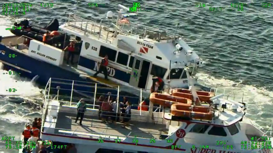 Video: NYPD Rescues Pregnant Woman From Stranded Boat | Officer
