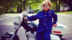 Boy in Police Uniform Riding Motorcycle Becomes Honorary Officer