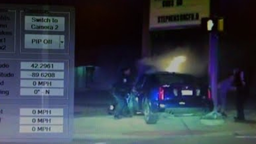 Video: Police Officers Rescue Two From Burning Vehicle | Officer