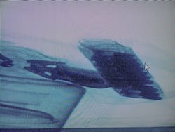 I tested out the x-ray system in a demo at Smart Imaging Systems Inc. Believe it or not, that's my badge and magazine. I tested out the x-ray system in a demo at Smart Imaging Systems Inc. Believe it or not, that's my badge and magazine.