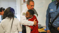 Lt. Eickhoff connects with students during a Secret Santa shop.